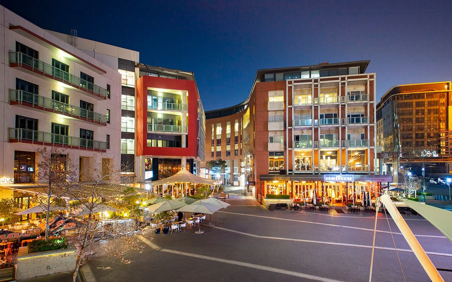 Melrose Arch public square and restaurants at night