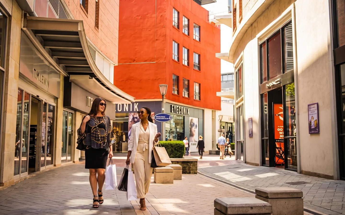 Shoppers walking through the Melrose Arch retail precinct